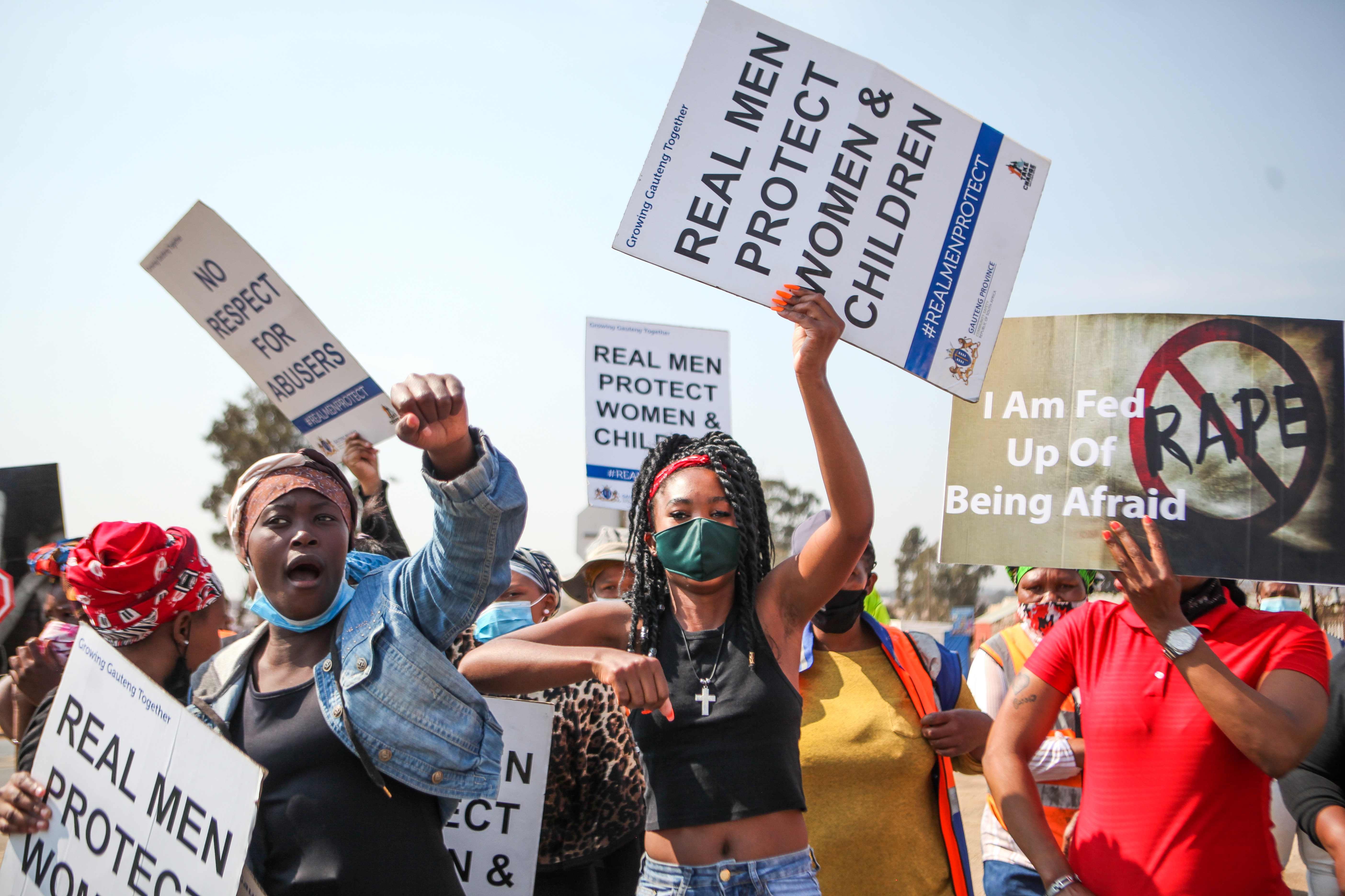 Community members protest against gender-based violence in Vlakfontein, South Africa, August 25, 2021.