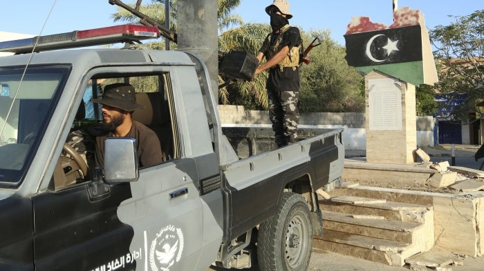 Libyan security forces stand guard in Tripoli, Libya, August 16, 2023. 
