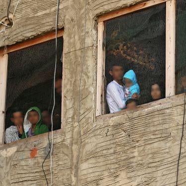 Syrian refugees in a building under construction they have been using as a shelter in a city in southern Lebanon, on March 17, 2020, after Lebanon urged people to stay at home for two weeks to stem a novel coronavirus outbreak.  